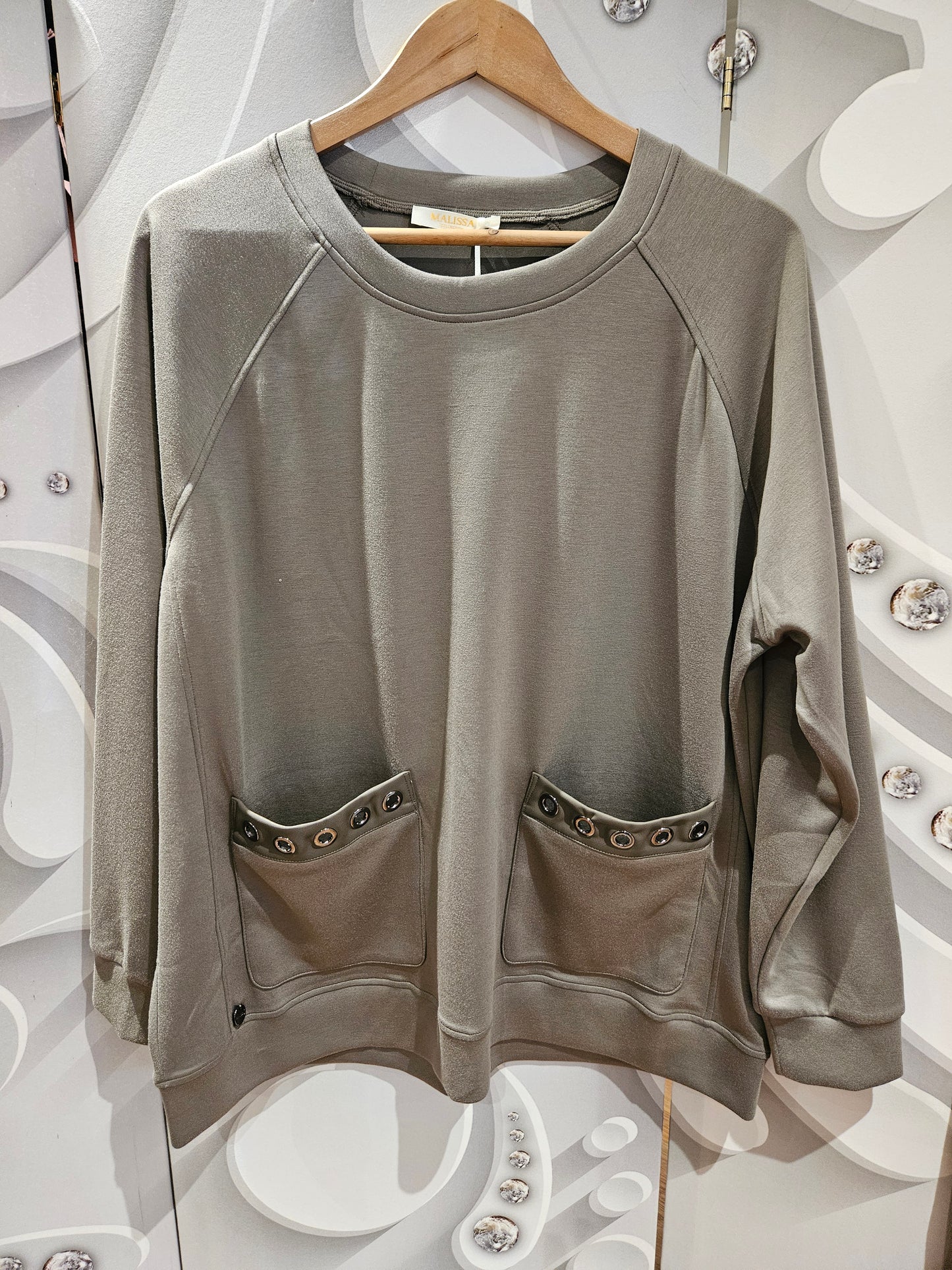 Top with Eyelet Pocket Detail