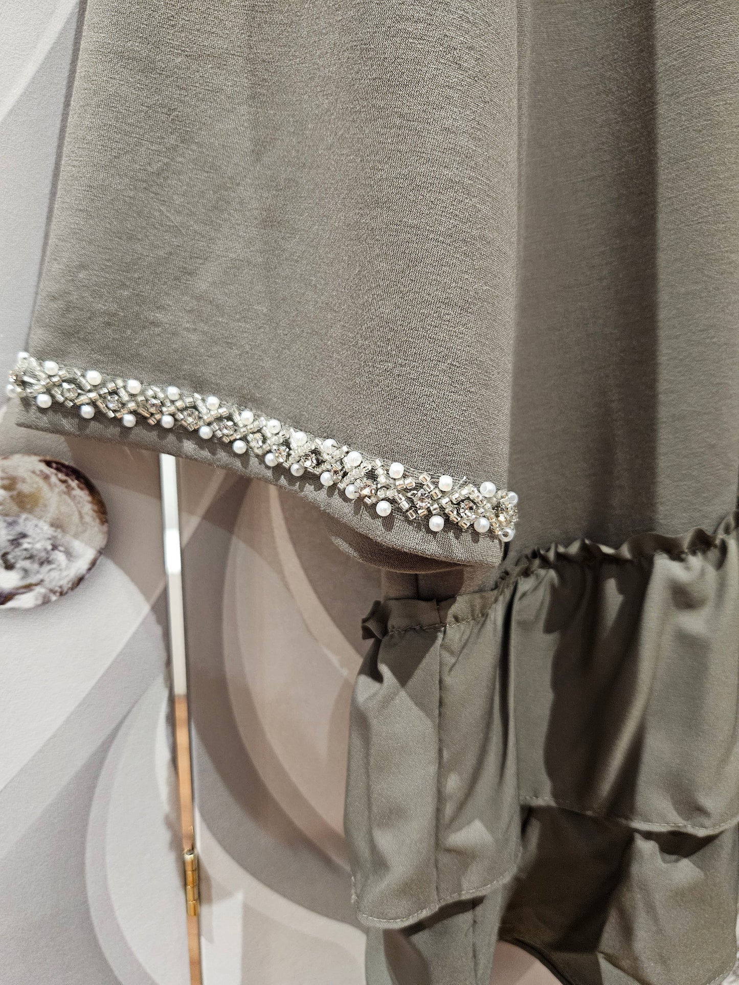 Tiered Hemline Top with Embellishment Detail